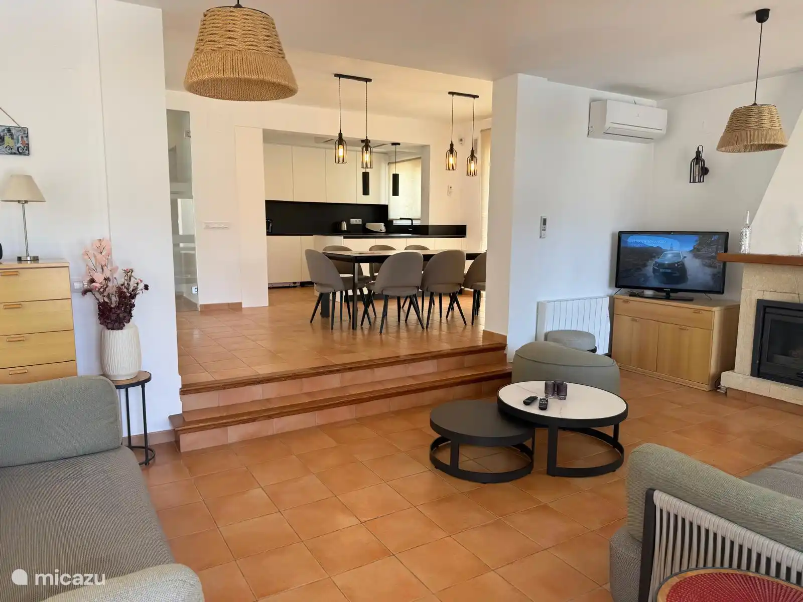 the living room with ensuite dining room and open kitchen