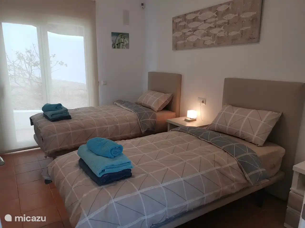 1 of the 3 bedrooms with new box spring beds and ensuite bathroom