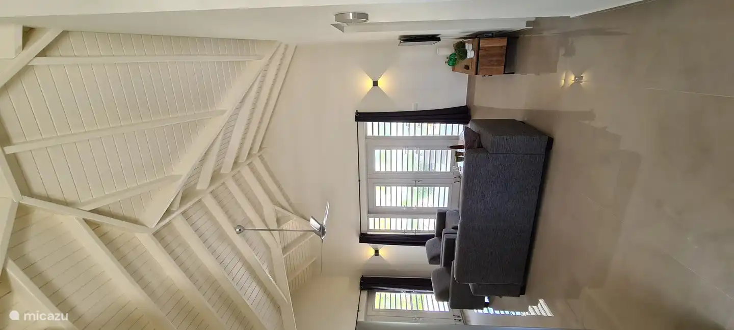 Living room with high ceiling.