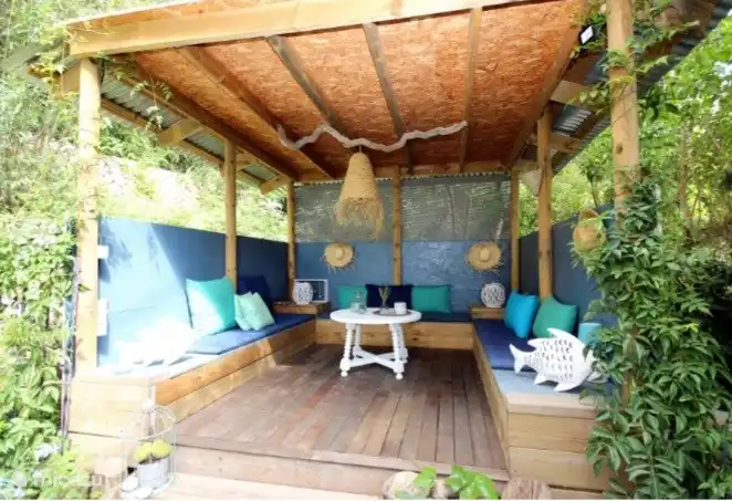 Cozy seat downstairs in the garden, with a view of the valley and sea