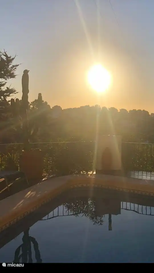 Beautiful sunset by the pool