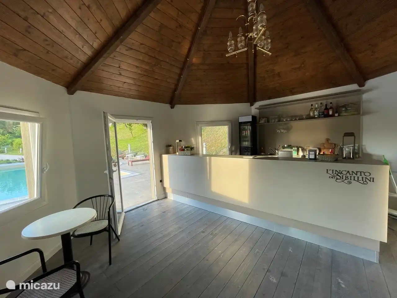 At the pool bar which is equipped with fridge, ice maker and air conditioning