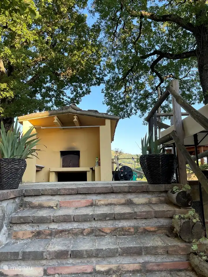 The outdoor oven for preparing pizza, bread, pies, cakes, biscuits, for example.
