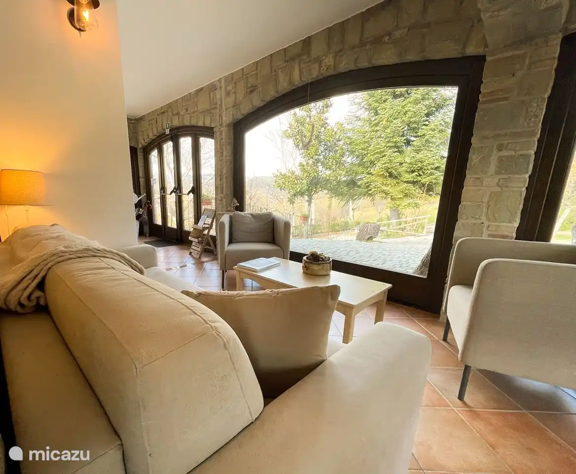 Small living room next to the bar with a view of the land
