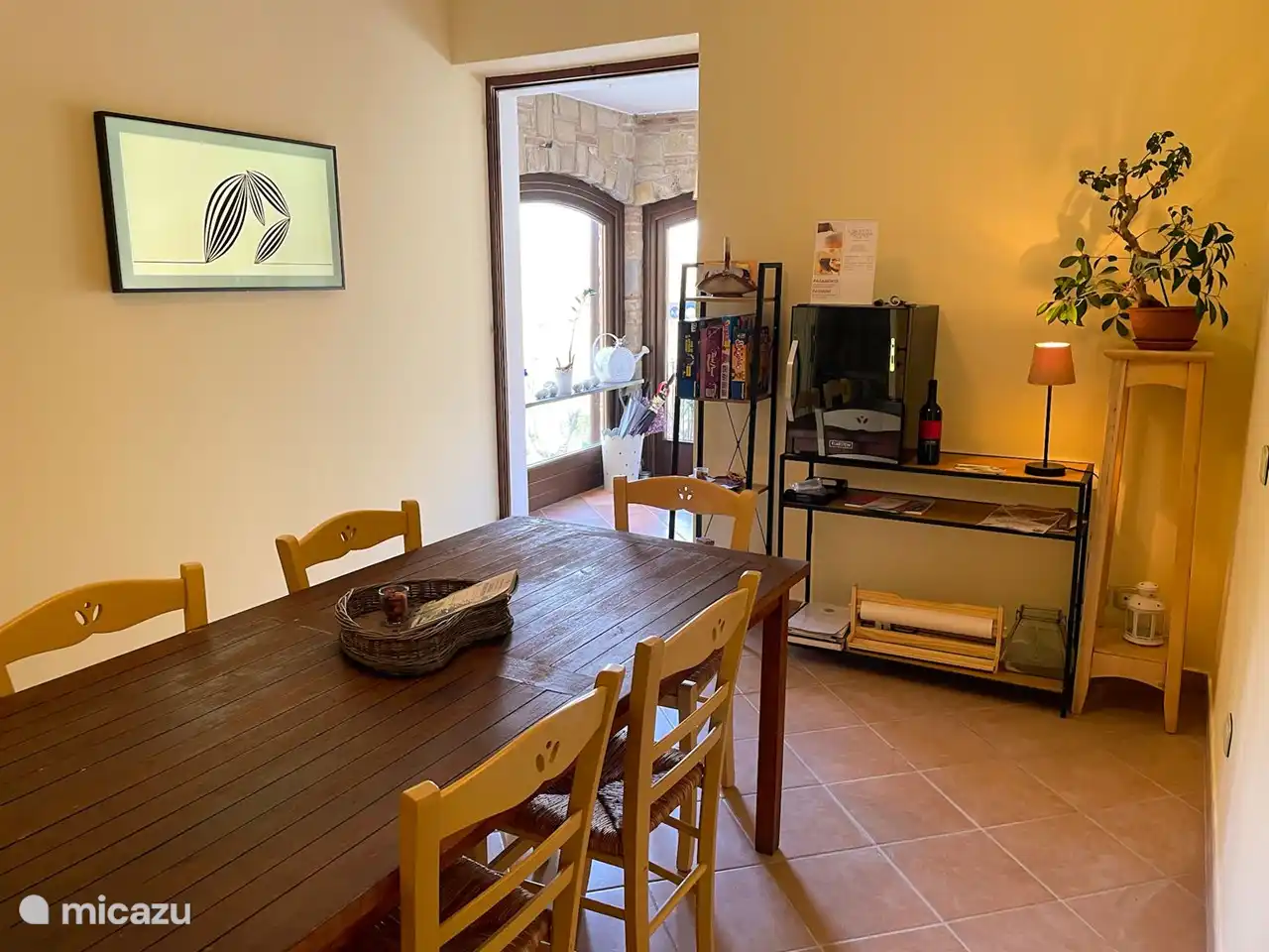 Room with smart TV, board games and mini fridge. With an adjacent toilet