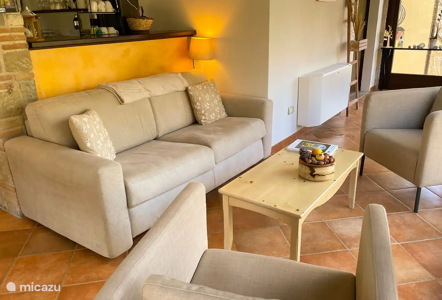 Small living room next to the bar with a view of the land