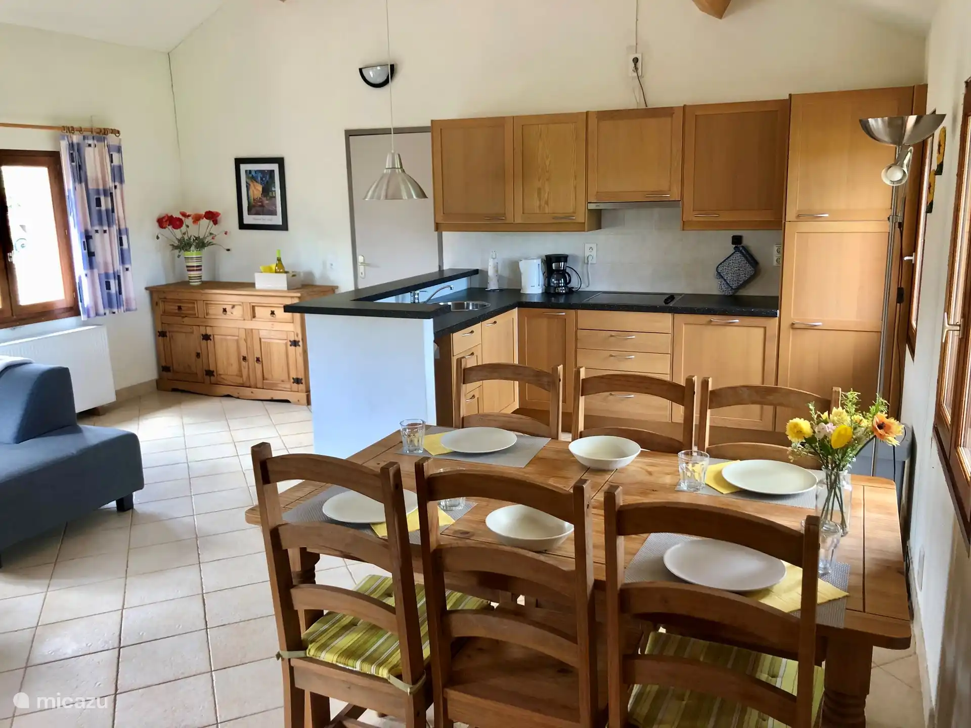 Living room with kitchen and 6 person dining table