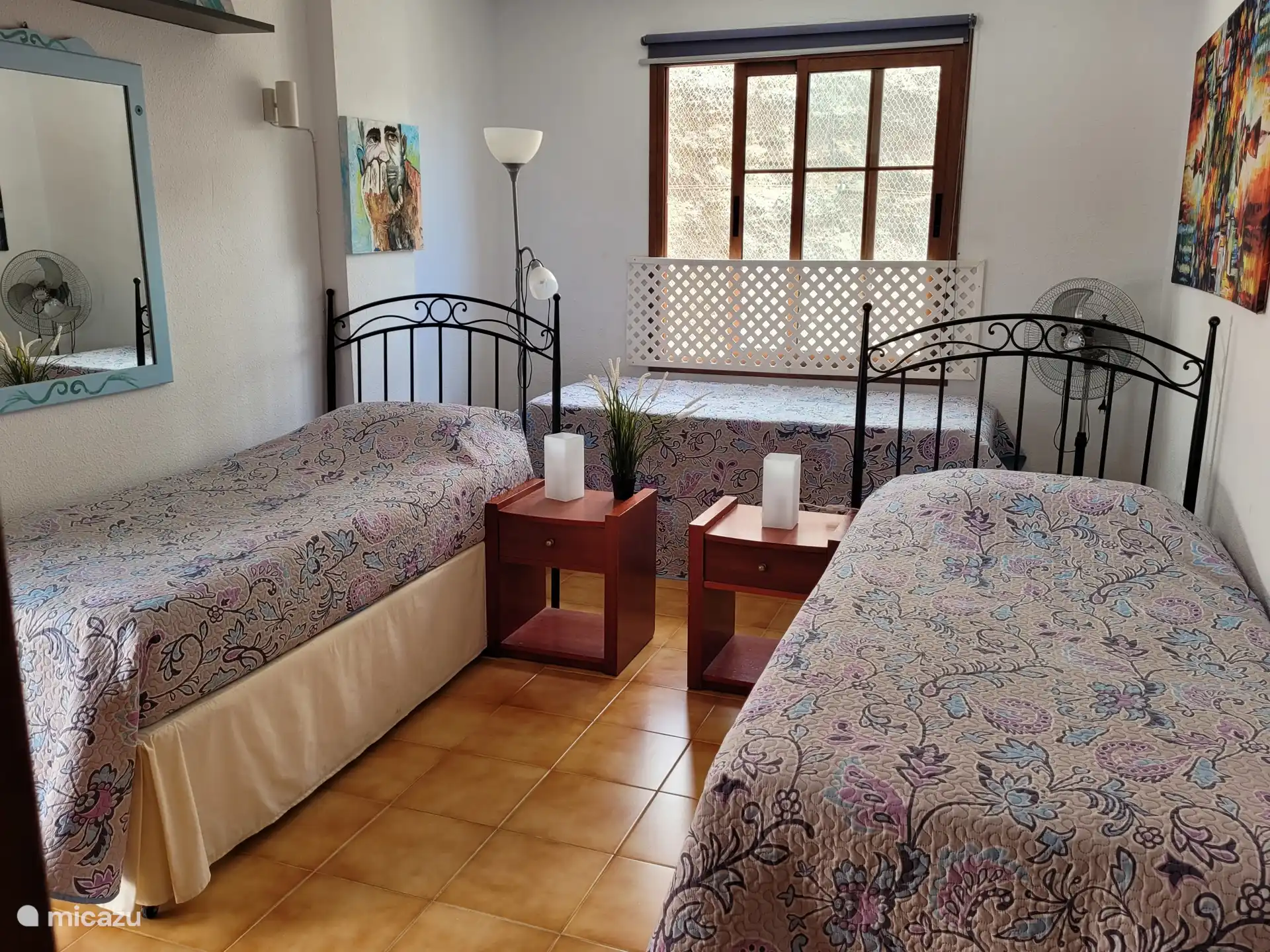 4-person bedroom with closet wall and door to terrace