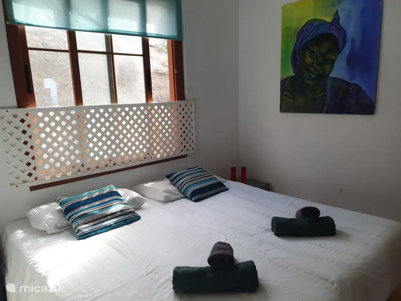 2 camas individuales unidas en el segundo dormitorio