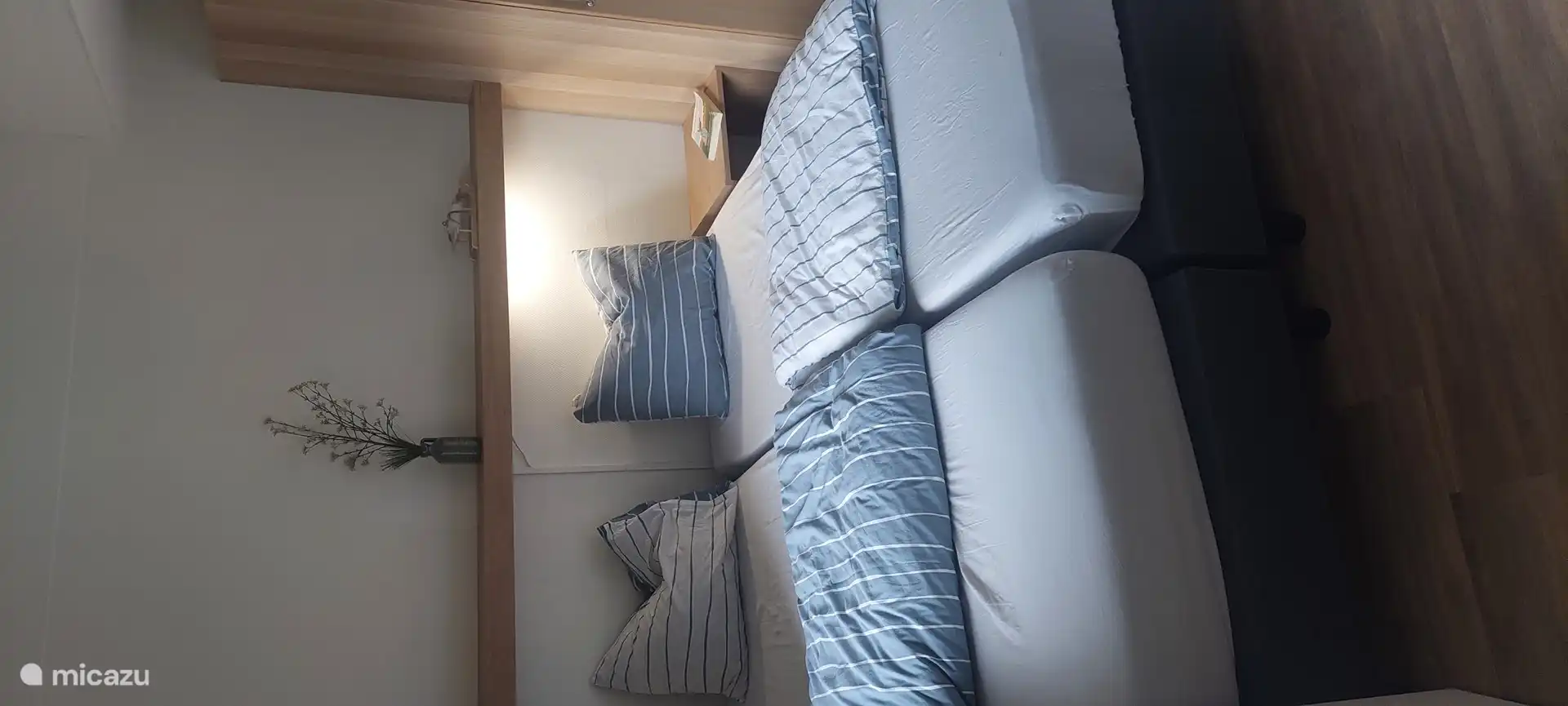 Second bedroom with entrance to bathroom. Beds together (are slidable). 