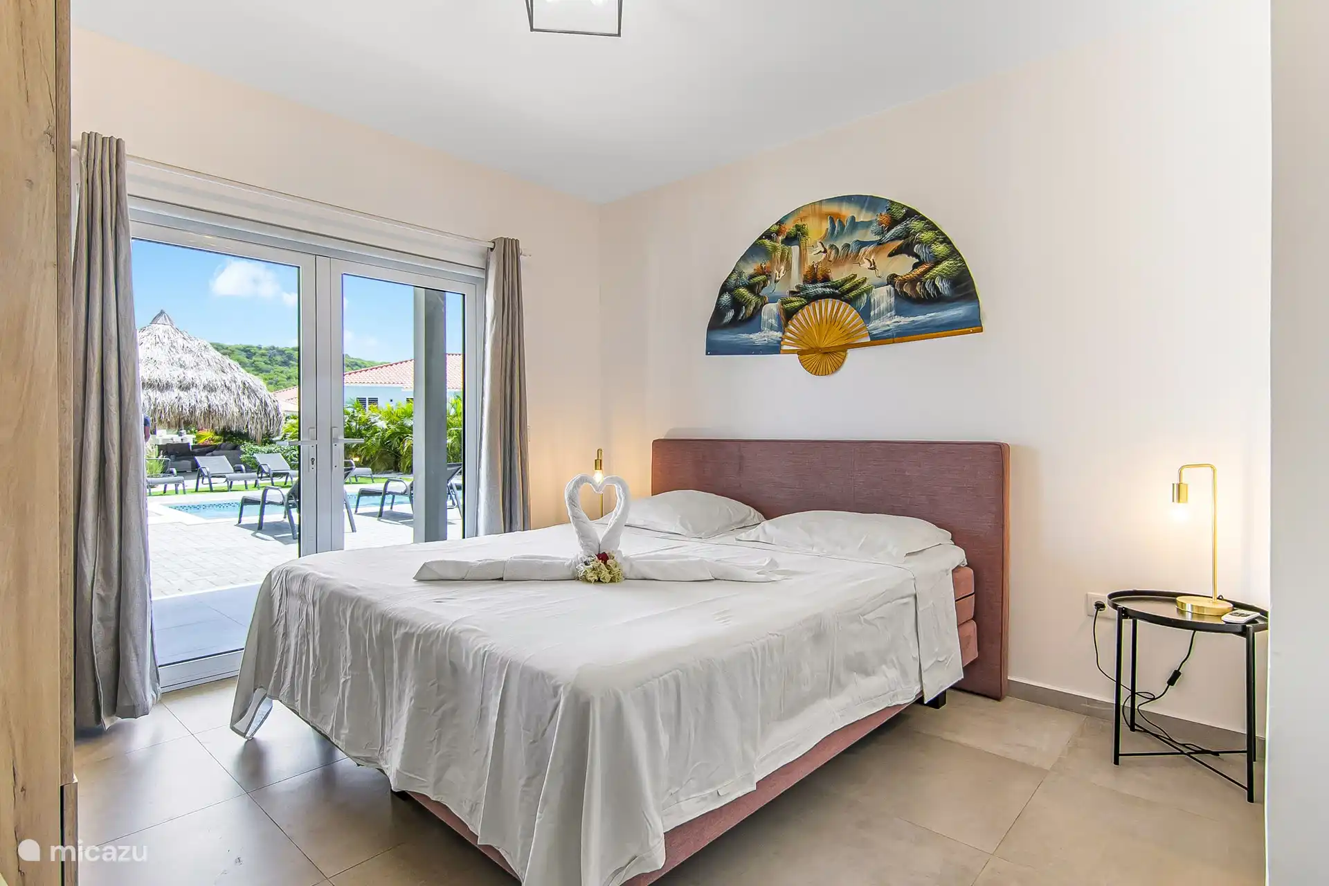 Villa Nisa - view bedroom with patio doors towards the terrace