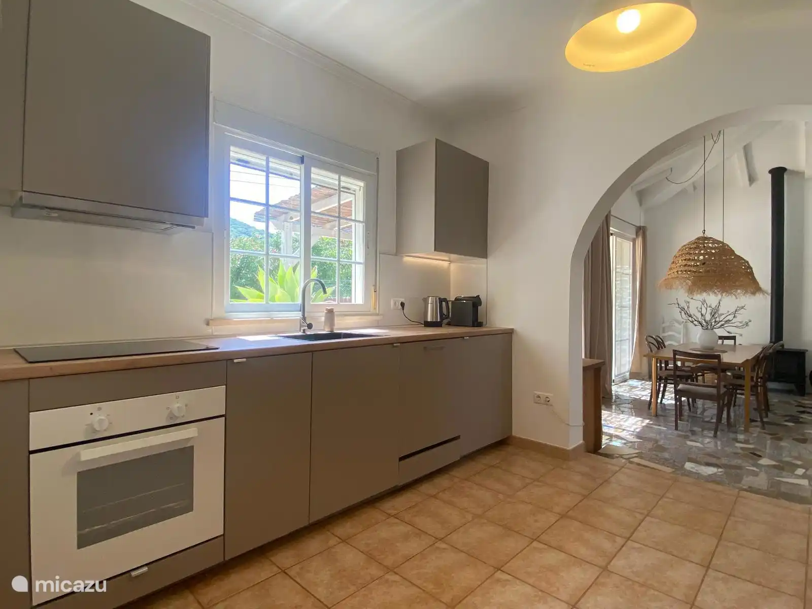 Fully equipped kitchen with garden view
