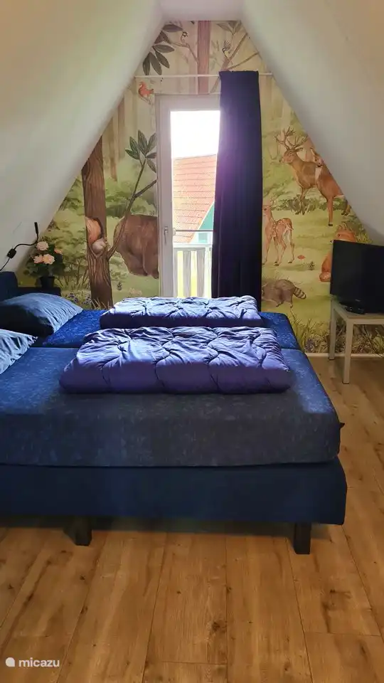 El segundo dormitorio de arriba, con 2 cómodas camas con somier