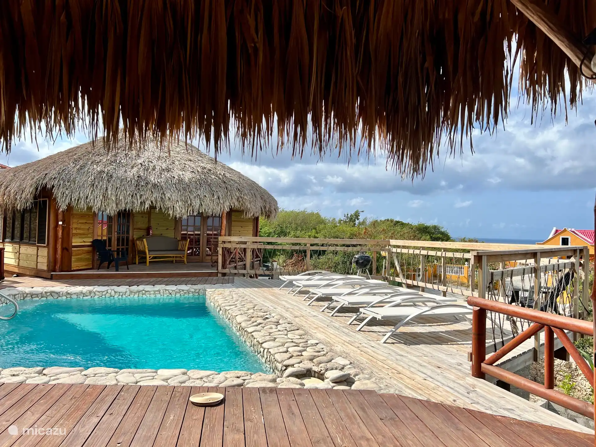 spacious swimming pool with loungers