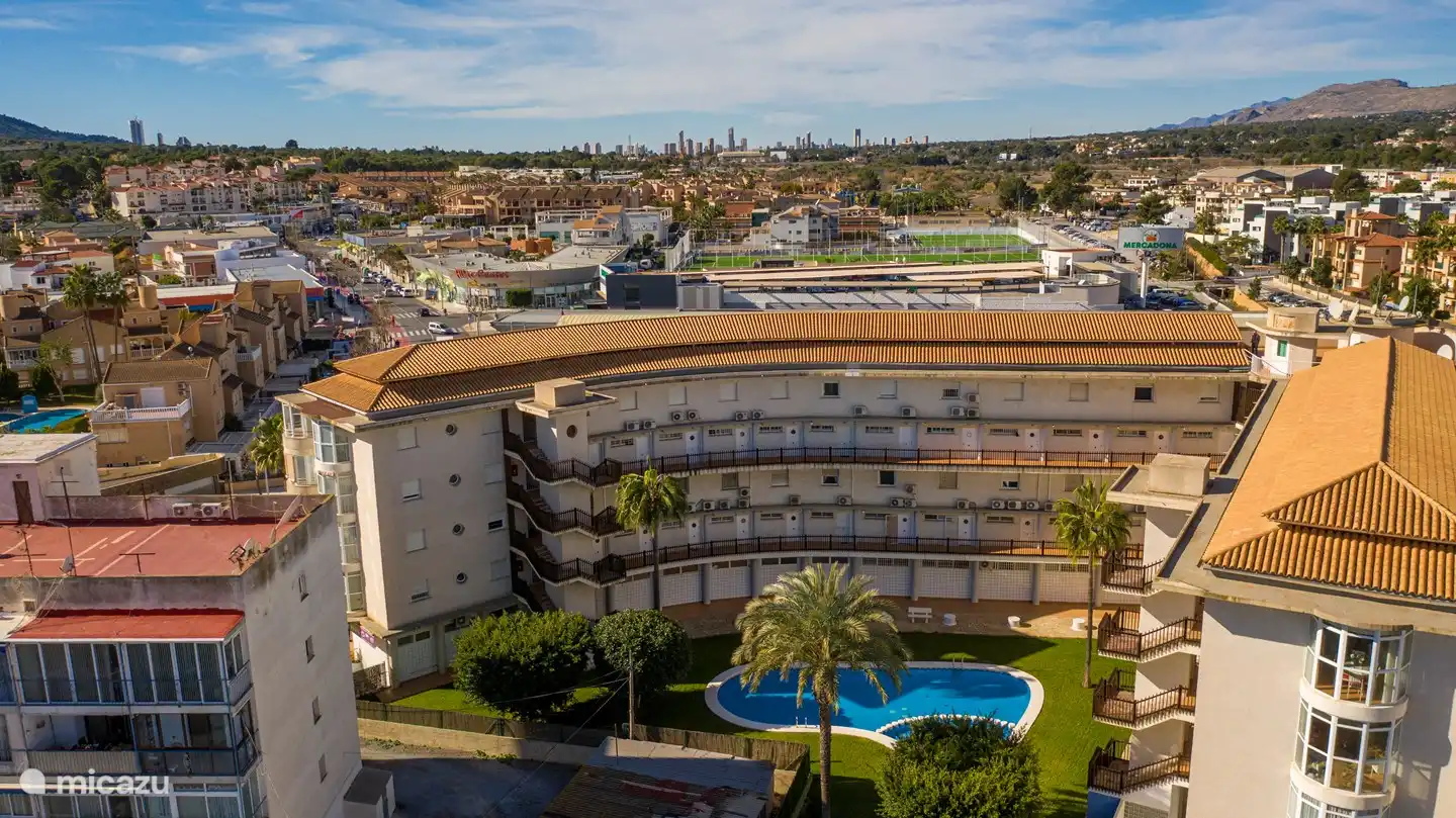 back of the apartment with communal pool