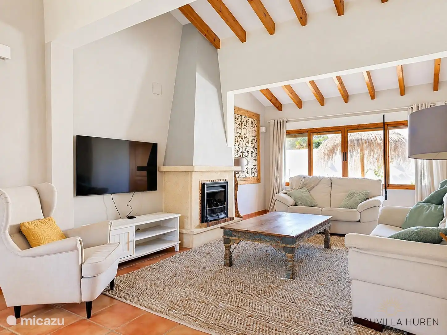 Gas fireplace and large TV in the spacious living room