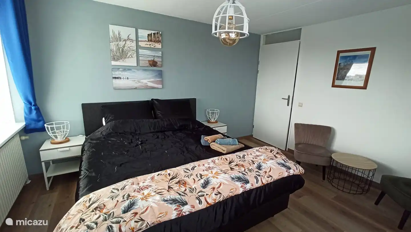 Chambre parentale avec coin salon
