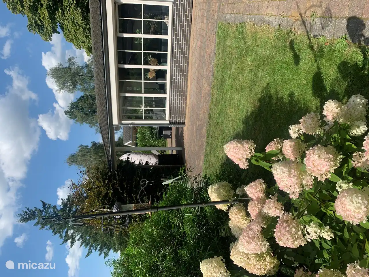 The spacious garden with lots of privacy and several sitting areas