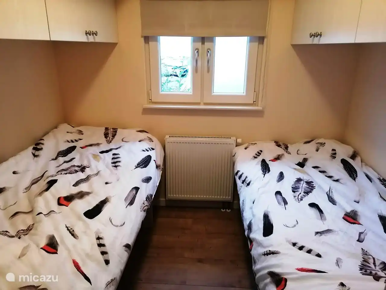 The 2nd bedroom with 2x a 1 person bed. Bring your own bed linen.