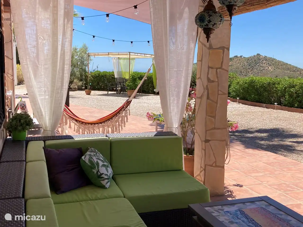 Tastefully decorated. Cloths and bamboo slats provide some extra shade if desired