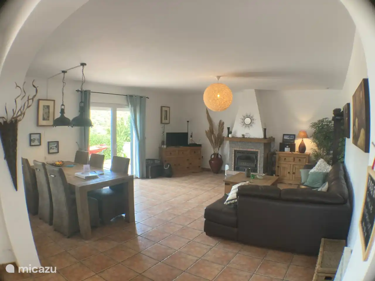 The living room is spacious and light. The soft leather corner sofa is comfortable.