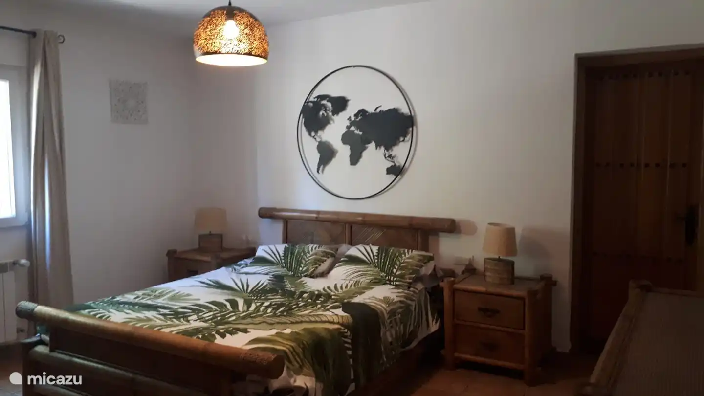 The master bedroom is spacious and attractively furnished.