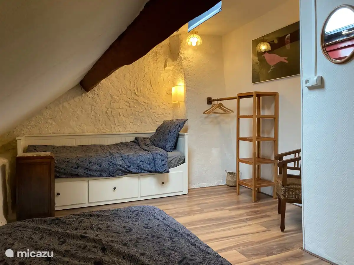 (Children's) bedroom upstairs with a single / double bed and a single bed