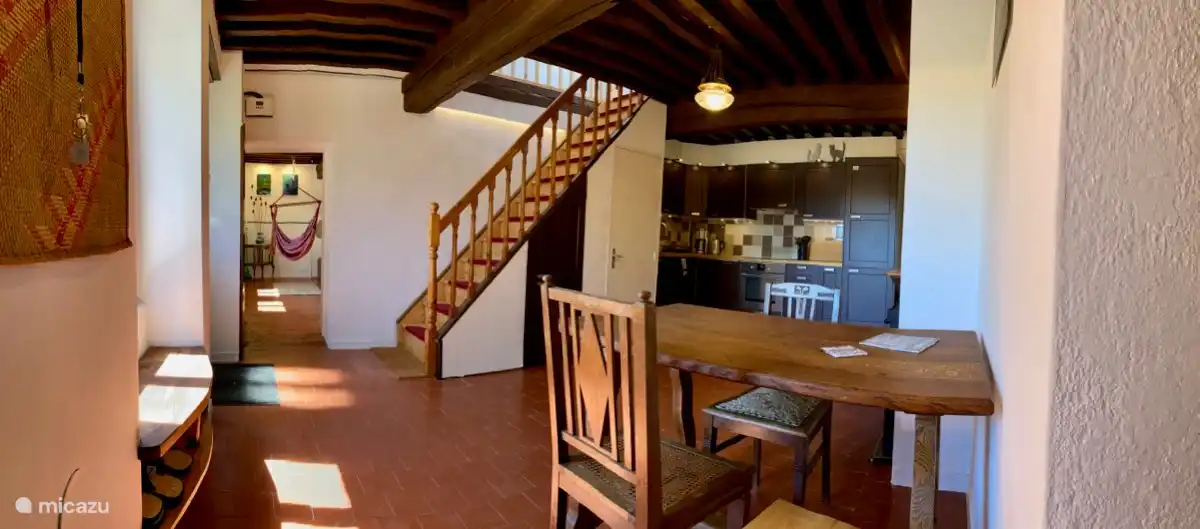 The kitchen is fully equipped and adjoins two rooms on the ground floor. Under the stairs is a small WC, especially useful at night.