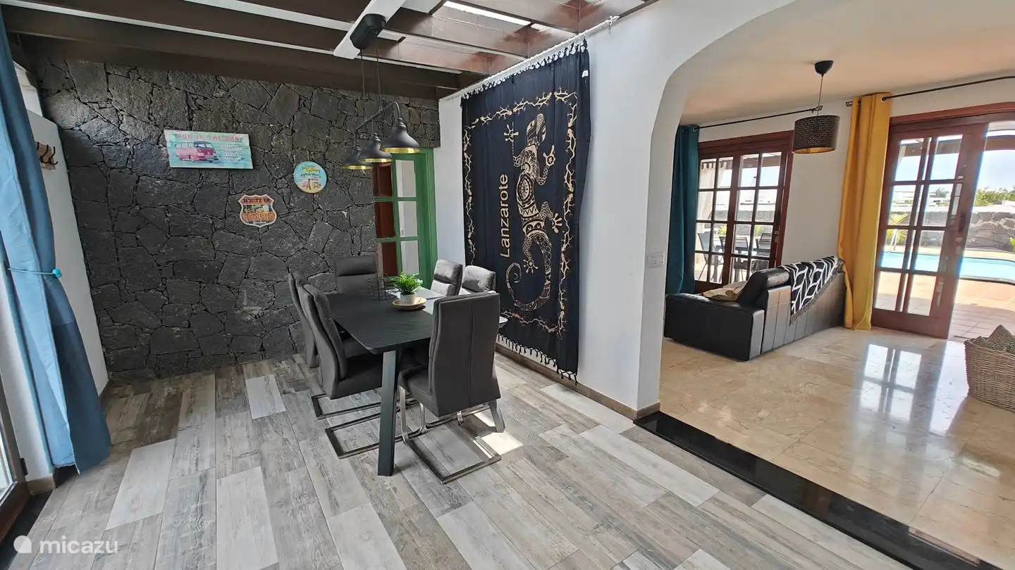 The modern and comfortable dining room with lots of daylight.