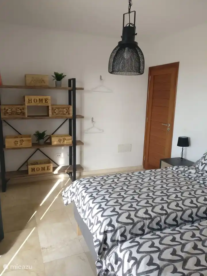 Twin bedroom ground floor overlooking the spacious terrace and swimming pool