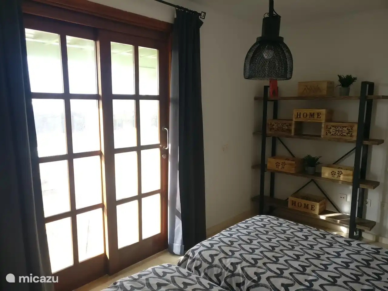 Twin bedroom ground floor overlooking the spacious terrace and swimming pool