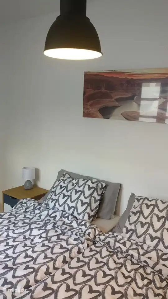 Twin bedroom on -1 with a view of an enclosed terrace