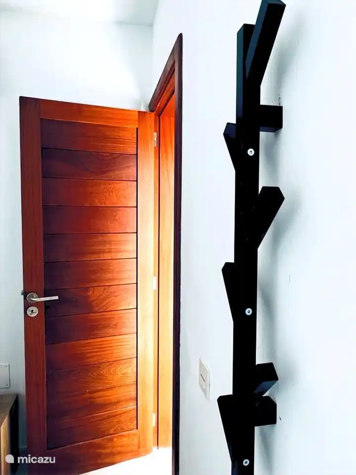 Twin bedroom on -1 with a view of an enclosed terrace