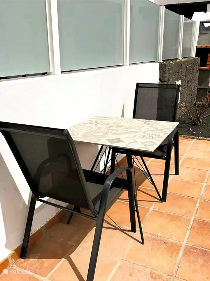 Cozy breakfast table for 2 in the morning sun