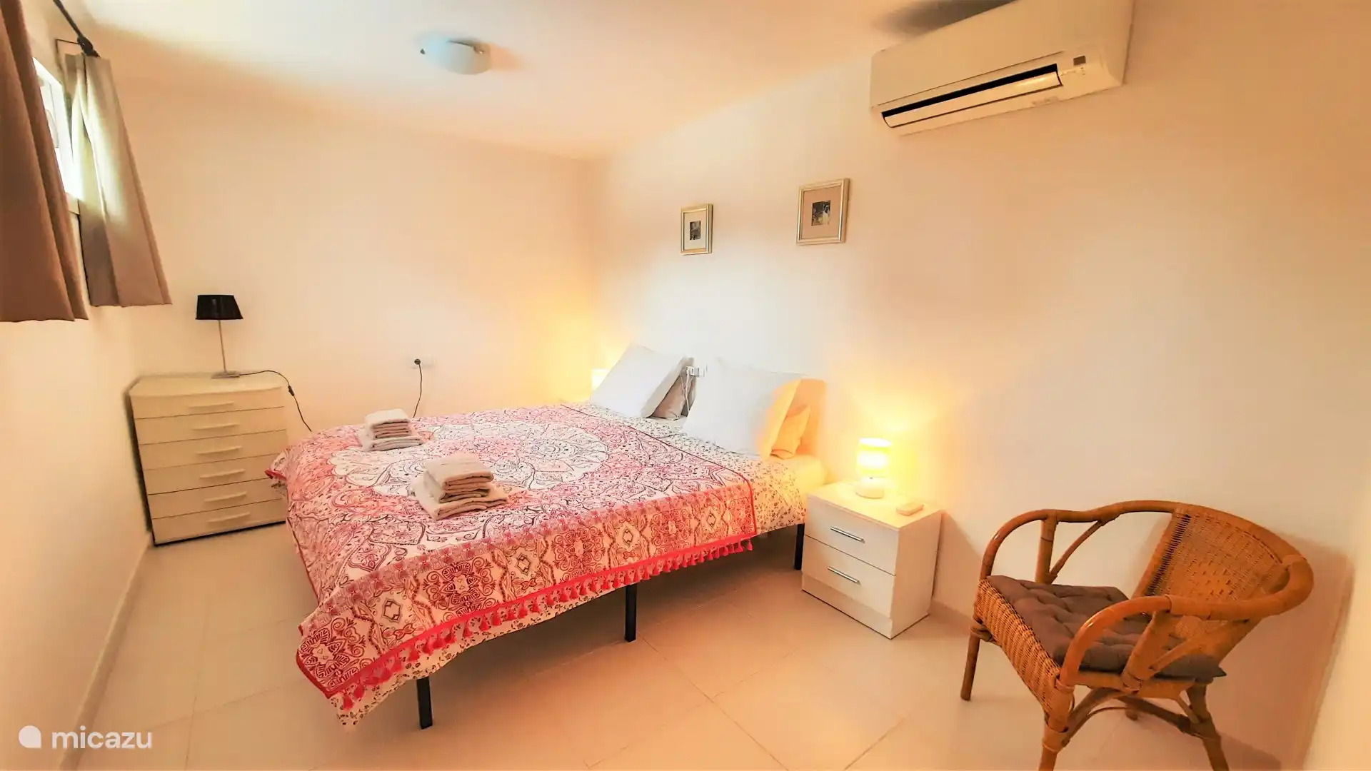 Spacious bedroom 3 on the ground floor with air conditioning and mosquito net