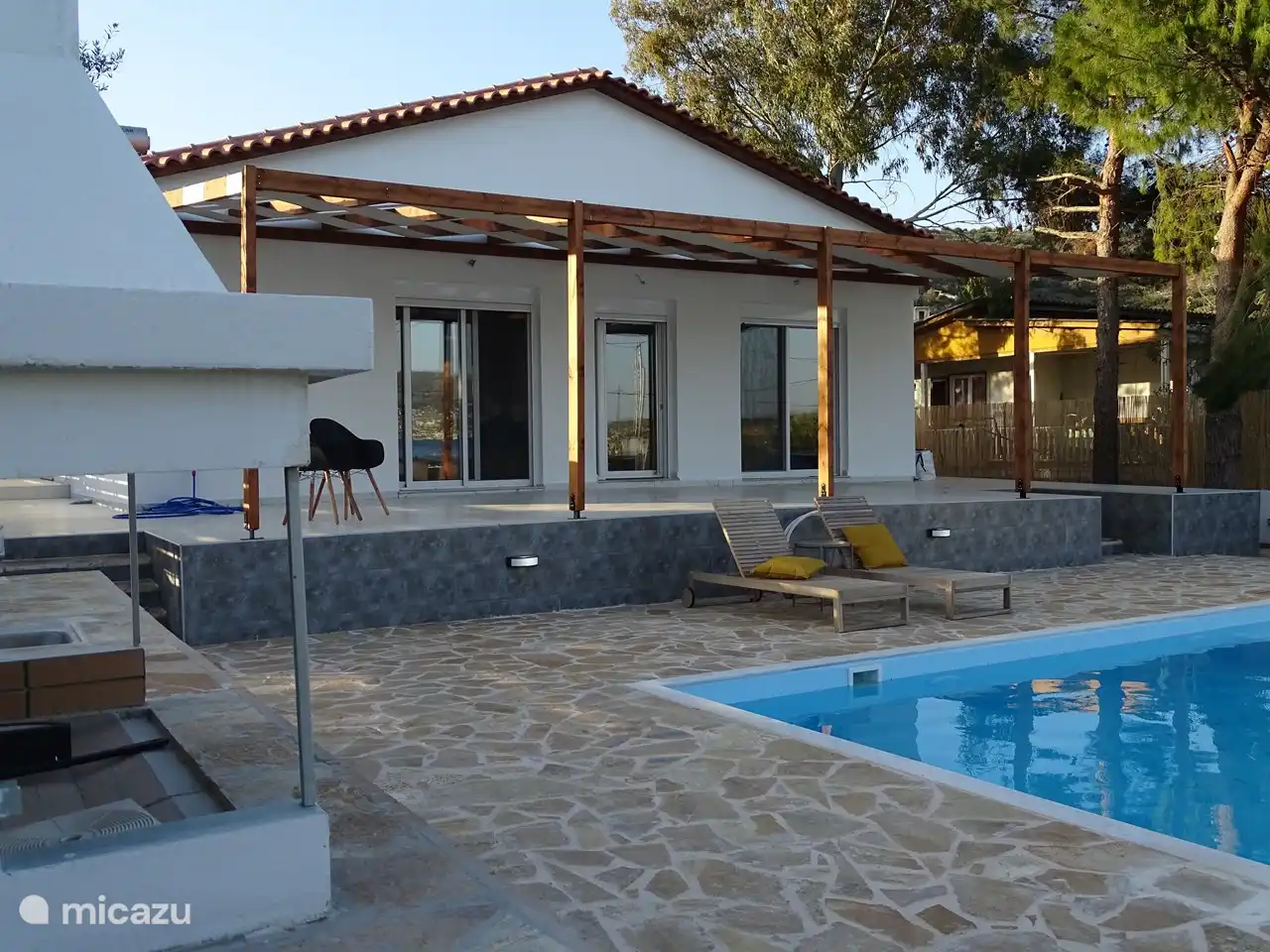 The outdoor kitchen and the spacious terrace