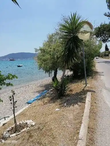 beach with broom near the villa
