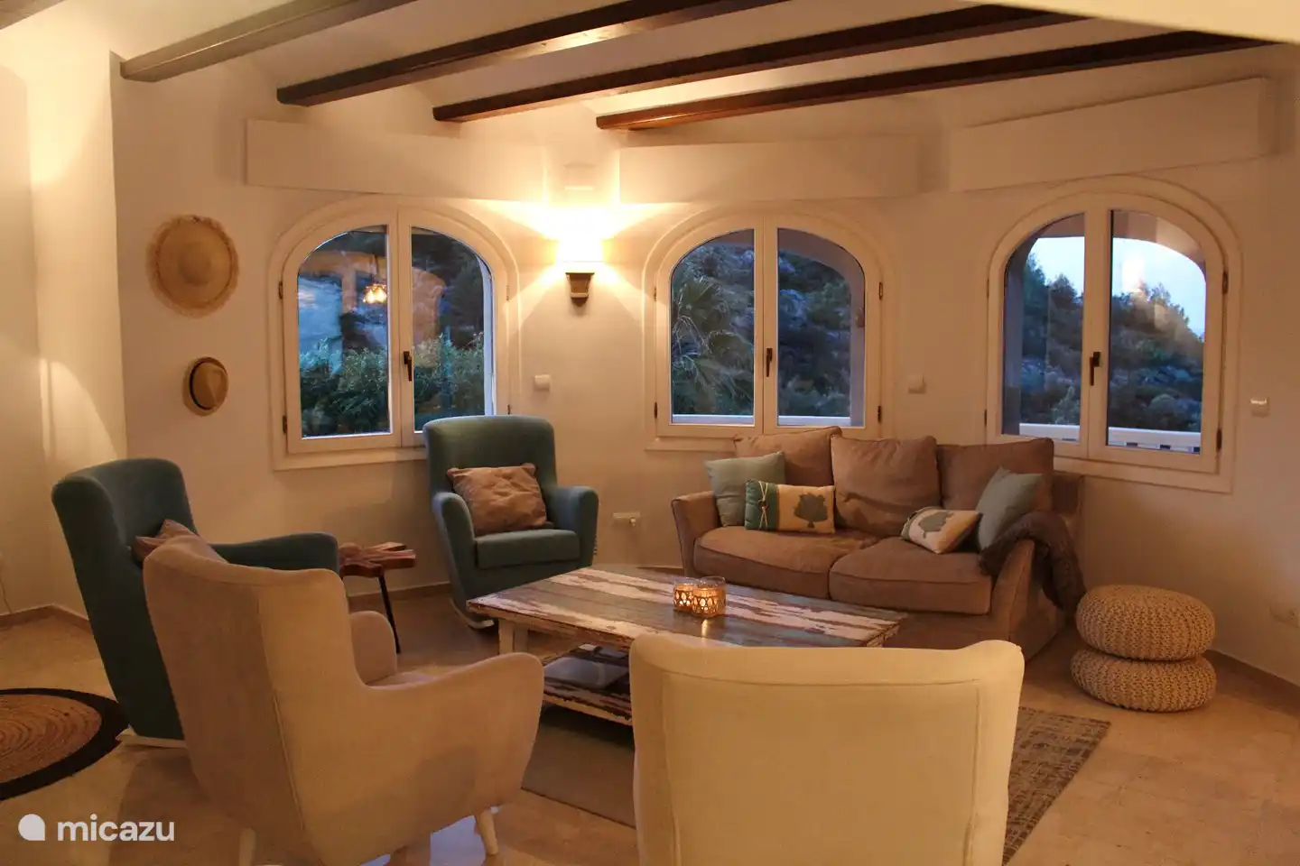 The living room with nice chairs and a comfortable sofa. (2/2)