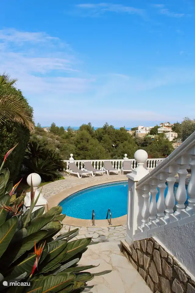 The swimming pool with a view of the sea in the background.