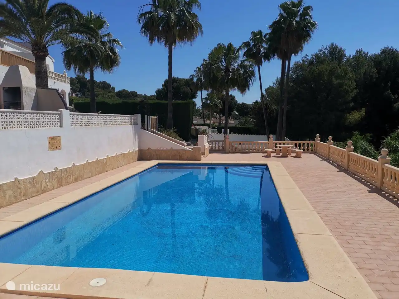 The large communal swimming pool is around the corner from the bungalow