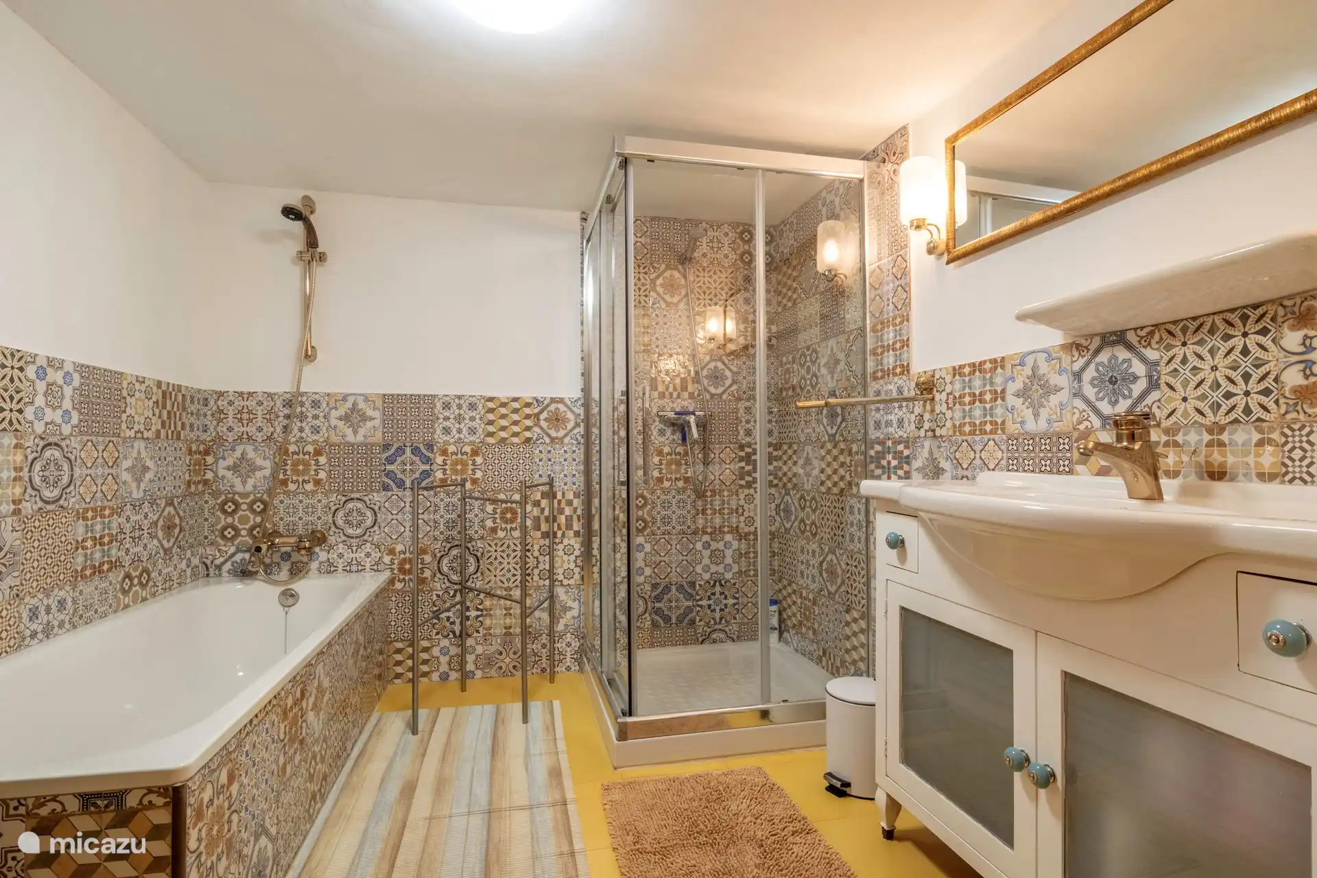 New downstairs bathroom with bathtub and separate shower. 