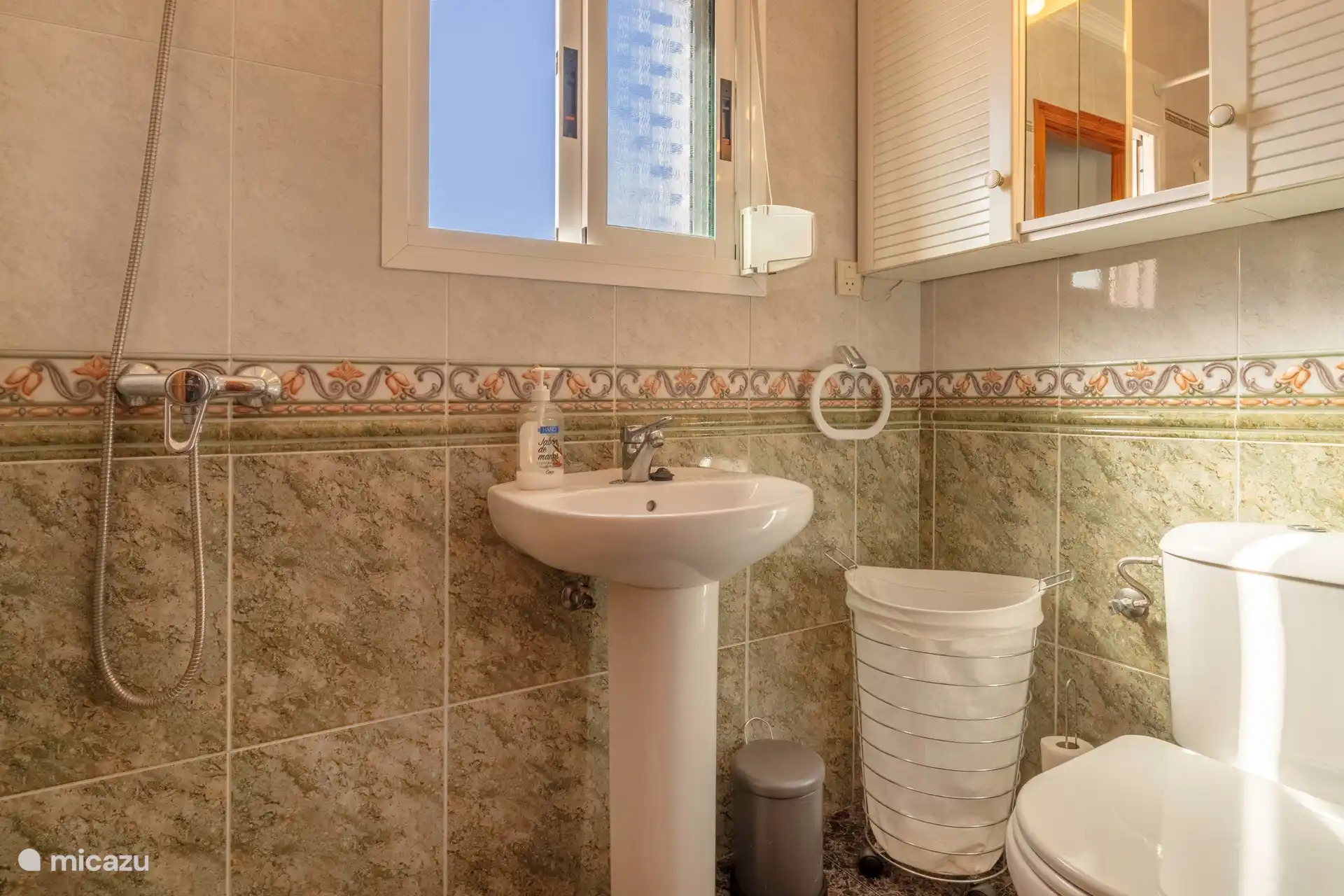 Small bathroom with shower and toilet on the first floor.