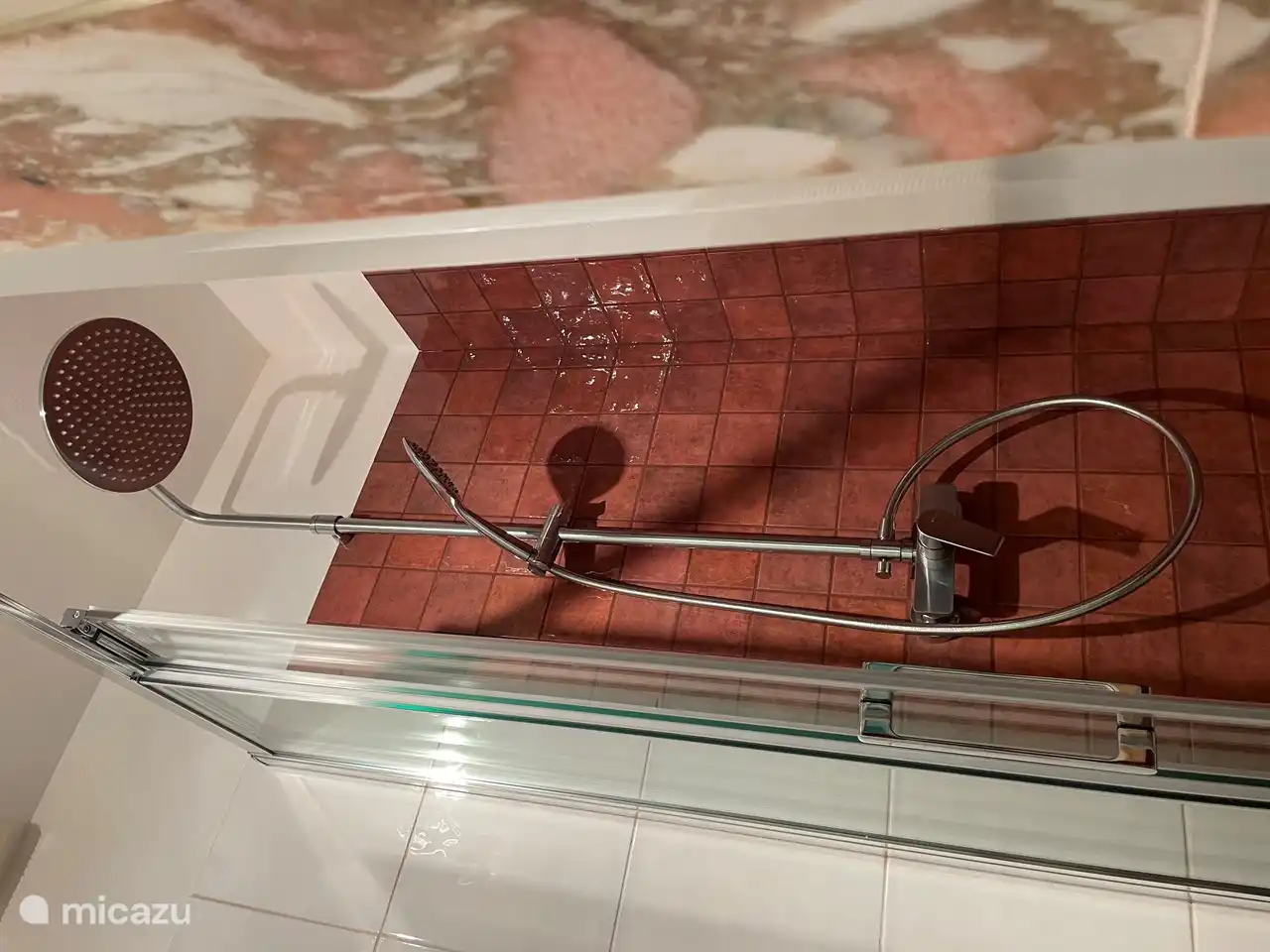 The bathroom was completely renovated in March 2023 with new floor, rainfall and normal shower, toilet and bidet.