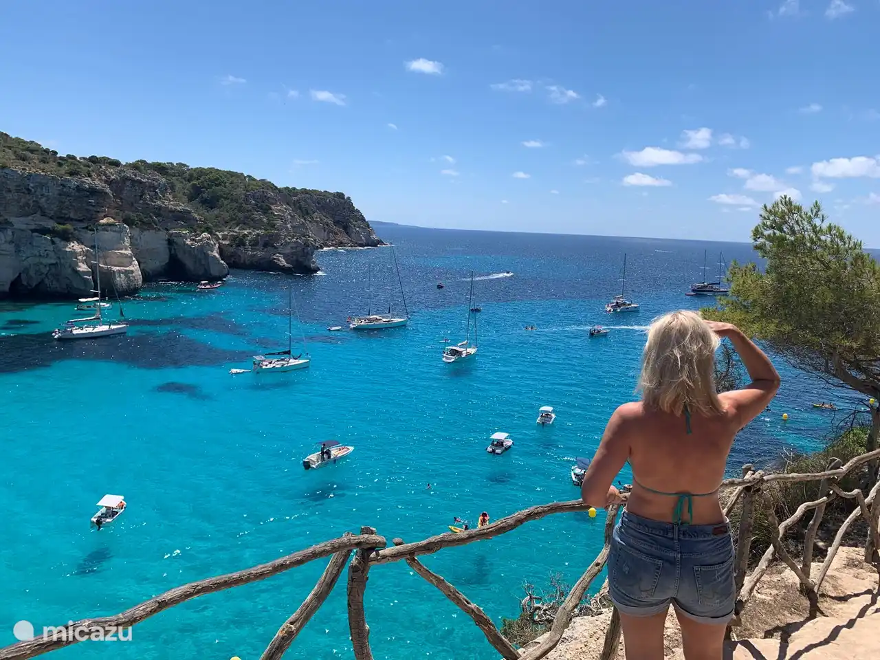 The bays on Menorca have crystal clear blue water. It often seems as if the boats are floating!