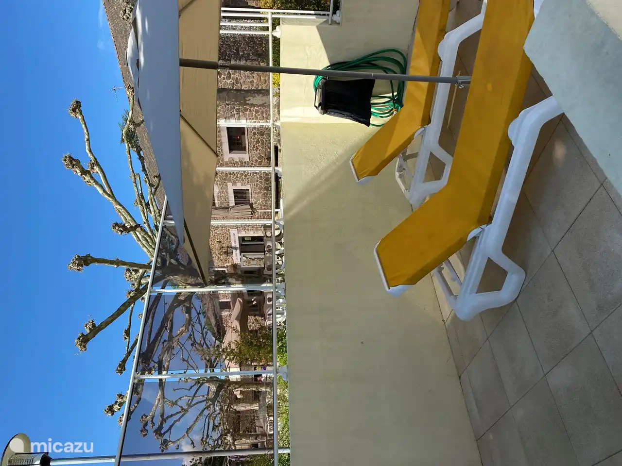 Large swimming pool with a view of the restaurant and terrace