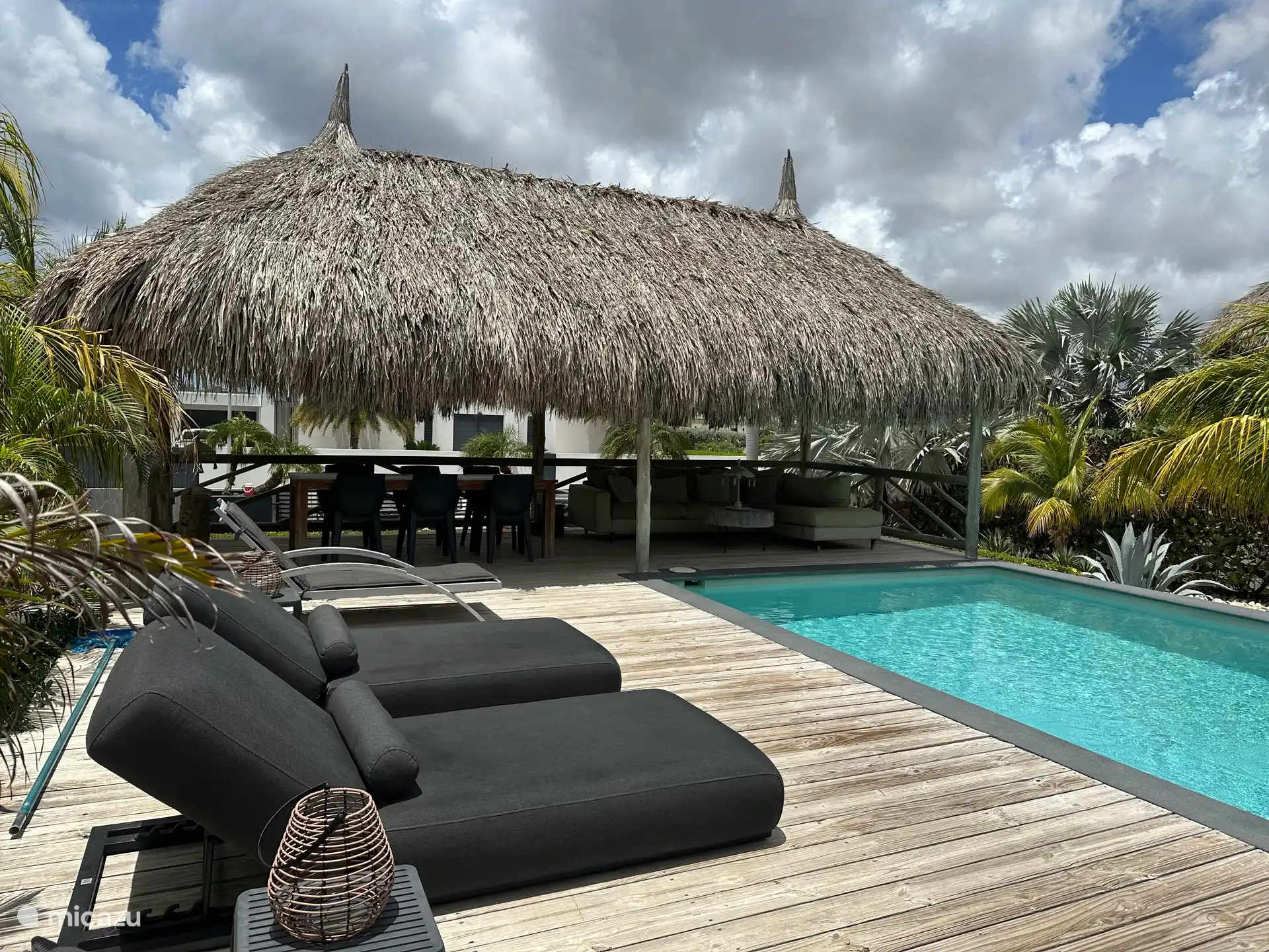 Sun deck and palapa at the mineral pool