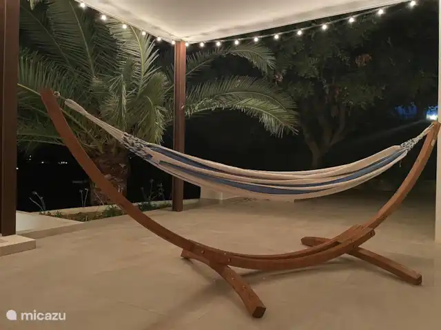 Location de Vacances Espagne, Costa Blanca, Benitachell, villa - Maison Quercia Détendez-vous dans le hamac sous le palmier