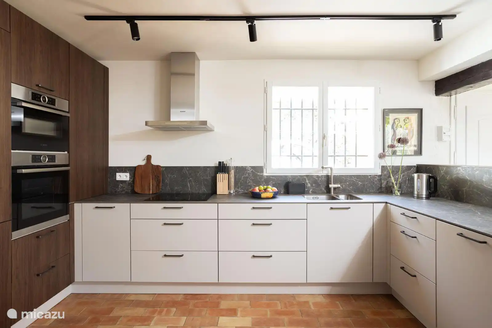 The open kitchen is fully equipped