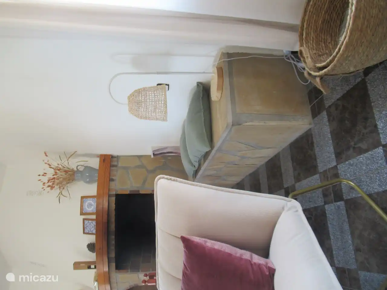 Living room with seat next to the fireplace