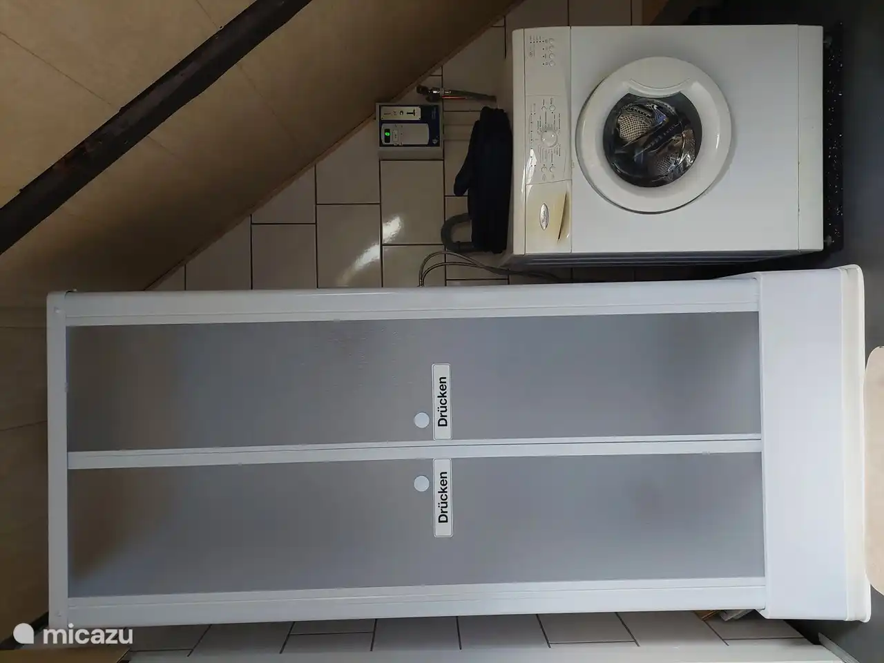 Washing machine works on a coin system, detergent is provided.